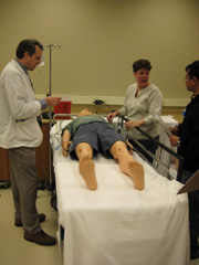 University of Missouri medical students and a nursing faculty member discuss the importance of safety and communication in preparation for a simulaiton exercise.