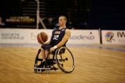 John Gilbert, a Mizzou Tiger Wheelchair Basketball Team member, brings the ball up the court at the International Wheelchair Basketball Federation championships.
