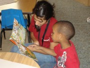 A jumpstart tutor and her student work on reading and comprehension. Jumpstart is funded by AmeriCorps and primarily works with low-income children ages 3 to 5.