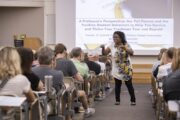 Cynthia Frisby, a professor with the Missouri School of Journalism, speaks to incoming students and guests in the Conservation Hall. MU has hosted the successful orientation program for 50 years.